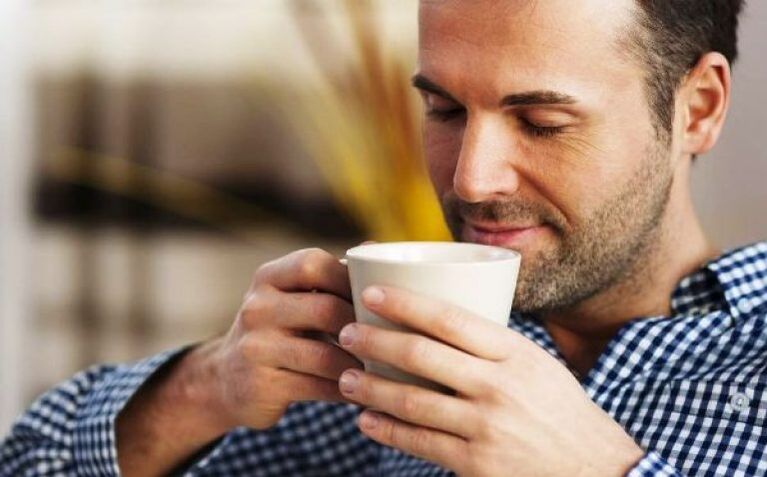 Men drink a cup of weed tea to boost potency